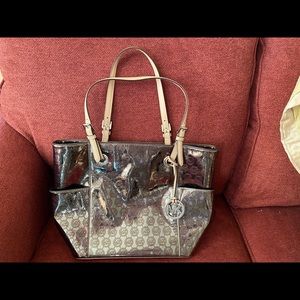 Michael Kors shinny gold purse.